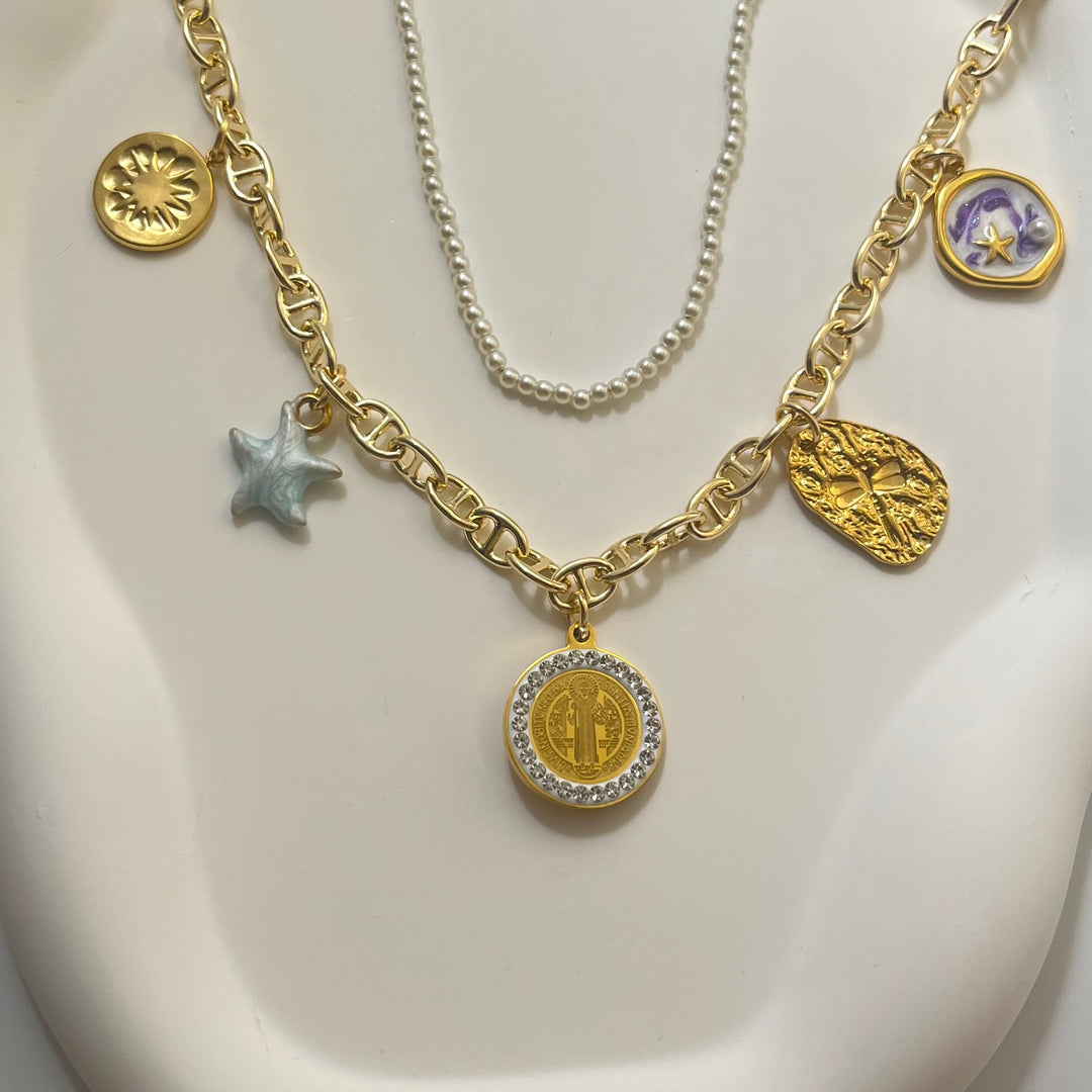 Layered Gold and Pearl Charm Necklace – T-Bar Clasp, Sun, Star, Crystal Coin, Vintage-Inspired Charms