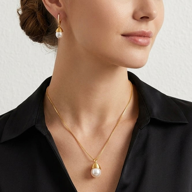 Model wearing Maylohas Classic Pearl necklace and huggie earrings
