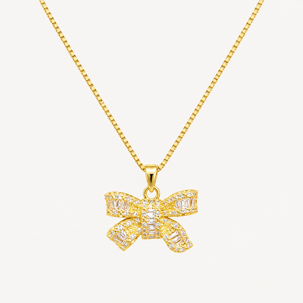 Gold bow pendant necklace