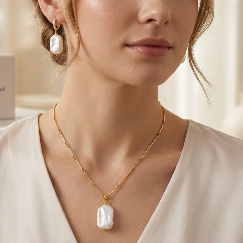 Model wearing Maylohas Rectangular Baroque Pearl necklace and huggie earrings
