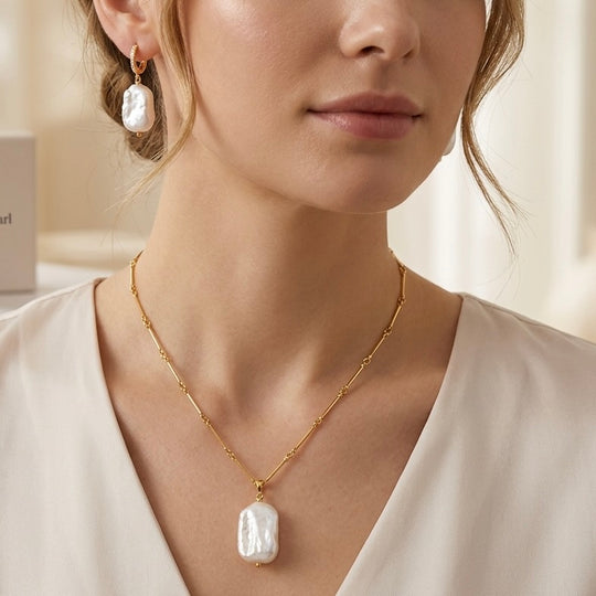 Model wearing Maylohas Rectangular Baroque Pearl necklace and huggie earrings